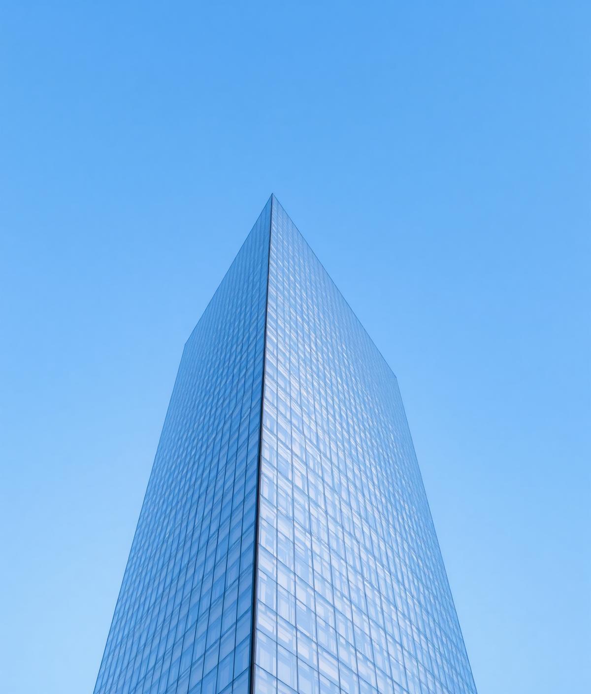 Modern glass skyscraper representing precision and structure